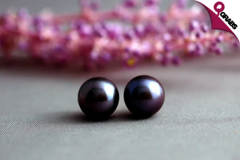 For QR89 get a Classically Stylish pair of Natural Fresh Water Black Pearl Earrings with Silver Studs (QR250 Value)